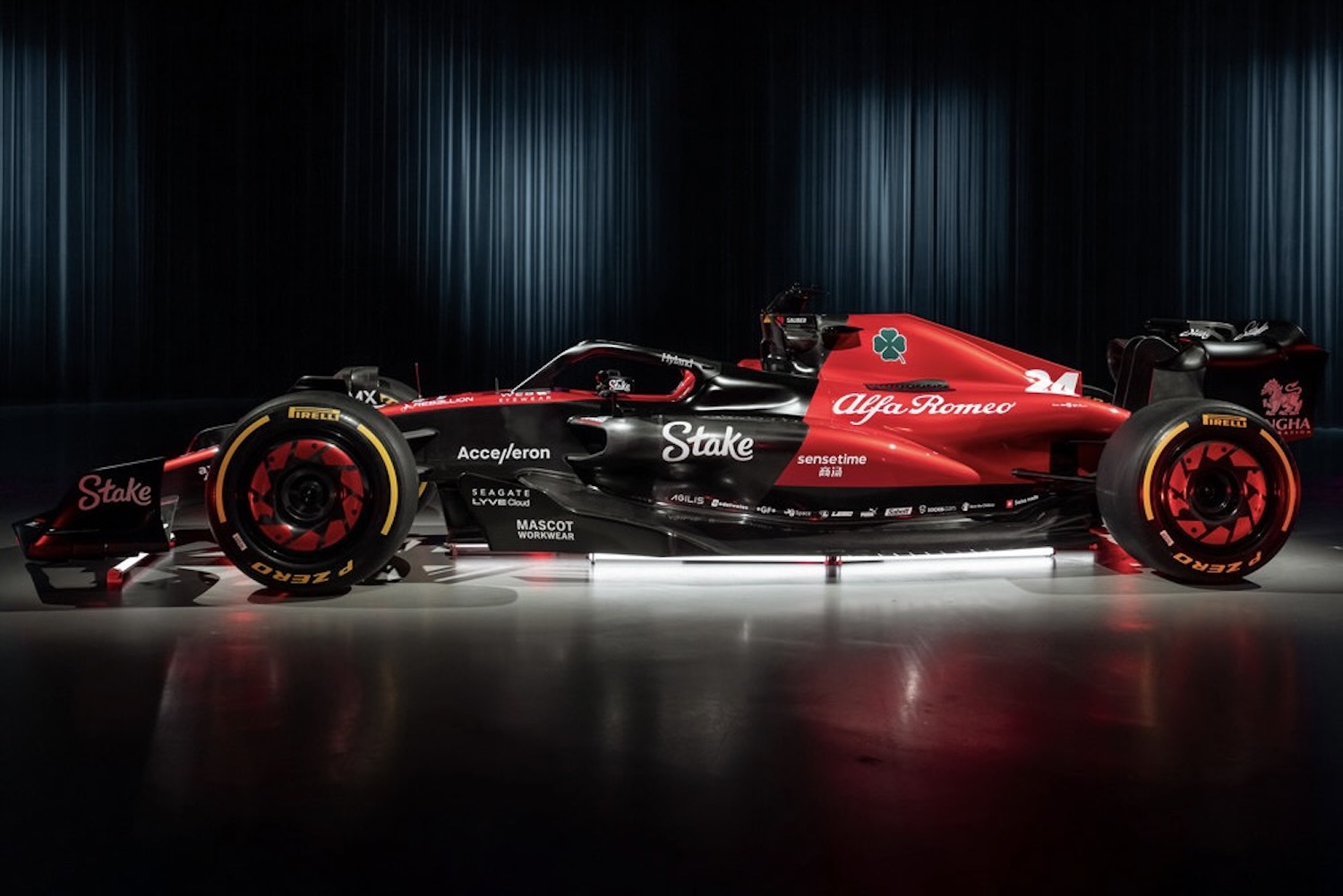 Side profile of the 2023 Alfa Romeo F1 C43 show car in a studio with studio lighting.