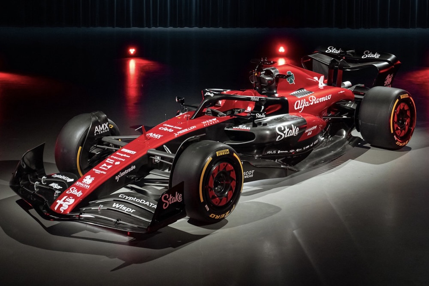 Front end angle of the 2023 Alfa Romeo F1 C43 show car parked in a studio with studio lighting.