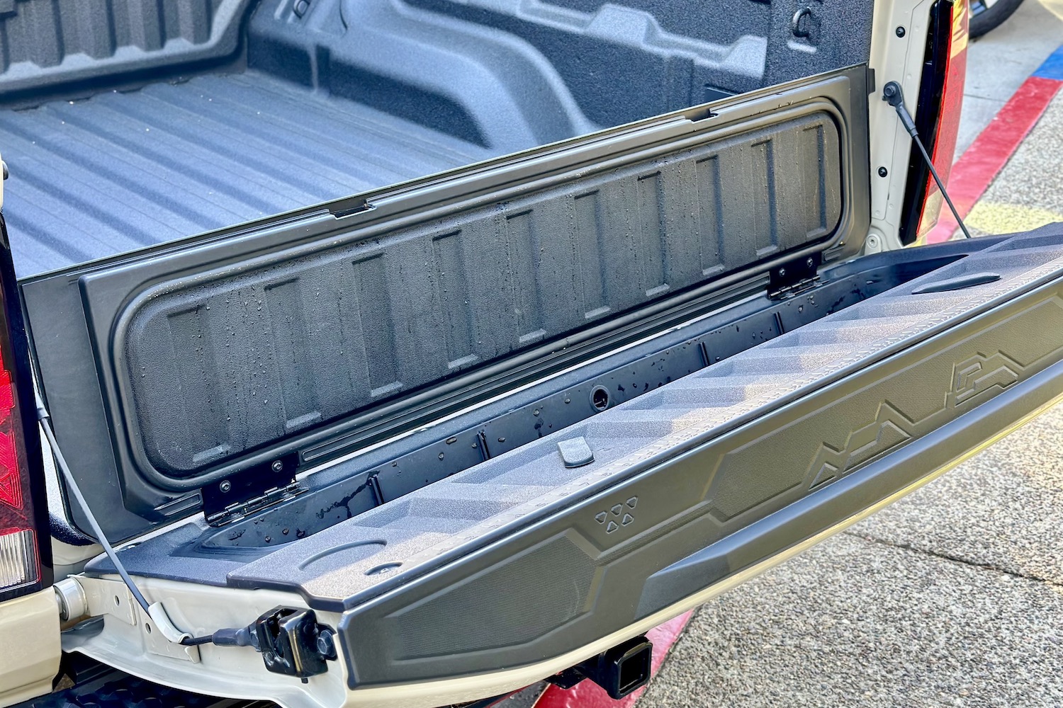 Close up of the under tailgate storage in the 2023 Chevrolet Colorado Trail Boss.