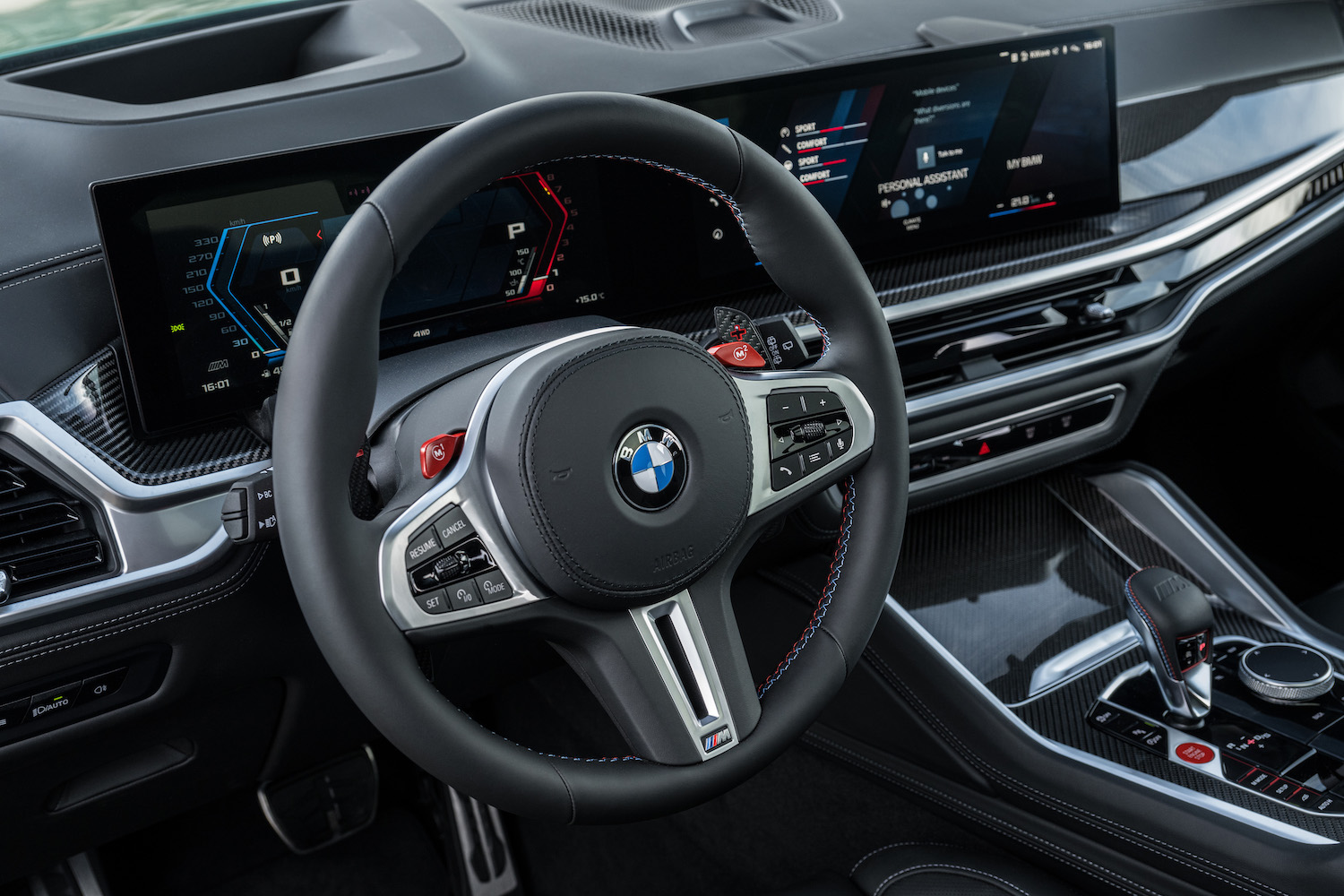 Close up of steering wheel in the 2024 BMW X5 M Competition from outside the vehicle.