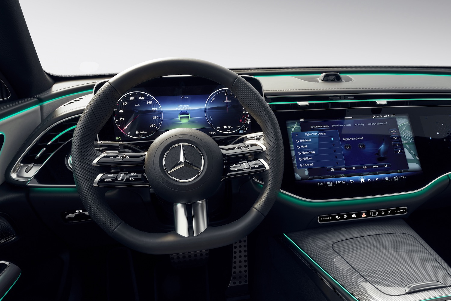 Close up steering wheel and dashboard in the 2024 Mercedes-Benz E-Class Superscreen from the driver's seat.