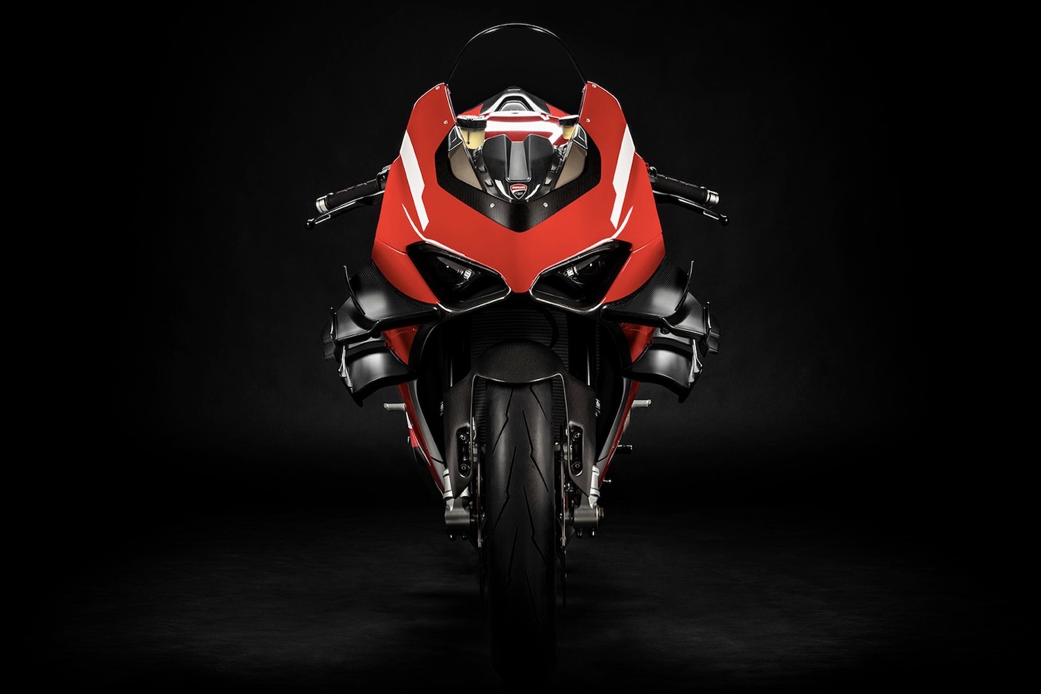 Ducati Superleggera V4 close up of front end of super bike with a black screen.