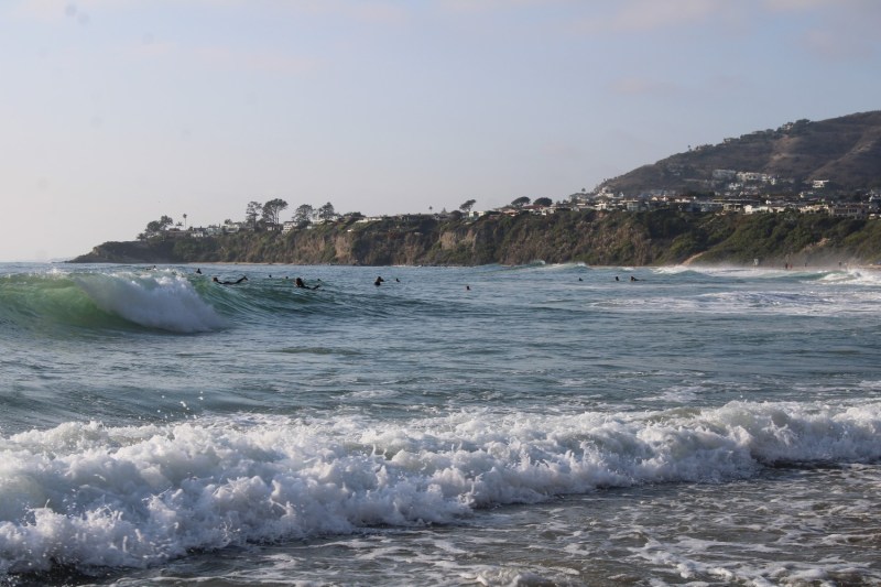 Surfers in the water at Salt Creek Beach in Dana Point, California.