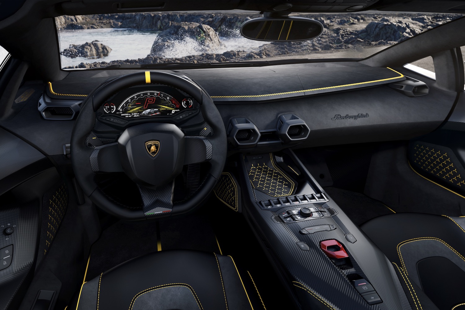 Close up of dashboard and steering wheel in the Lamborghini Auténtica with water and cliffs in the back.