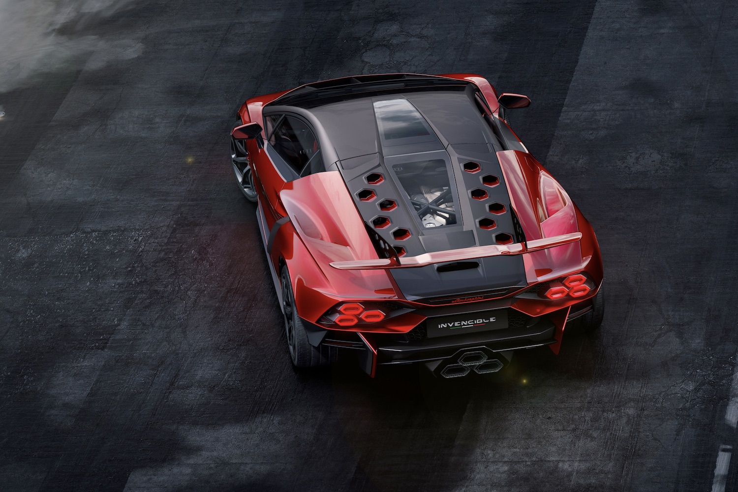 Rear end angle of Lamborghini Invencible from overhead showcasing engine and rear wing on wet tarmac.