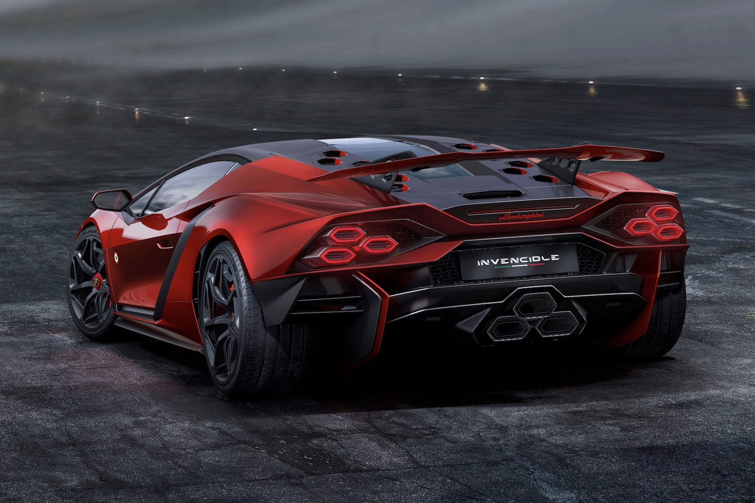 Lamborghini Invencible rear end angle parked on the side of a air plane runway with dark clouds.