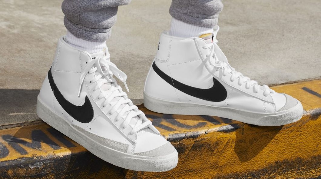 Nike gear, sneakers, worn on the sidewalk during an outing.