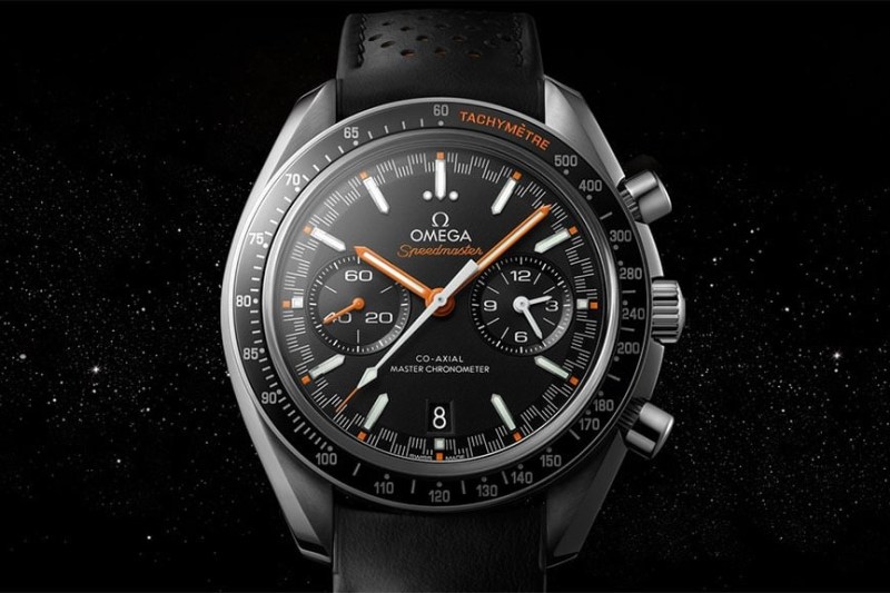 Omega Speedmaster Racing watch floating in space with stars in the background.