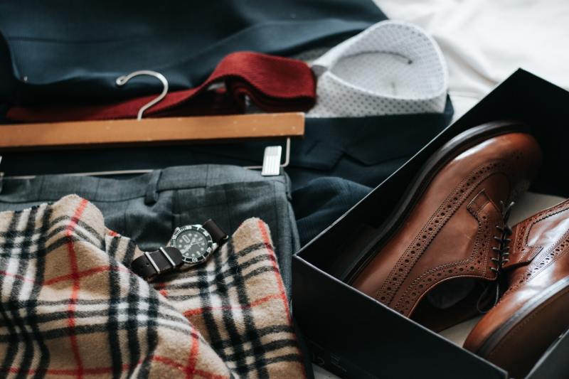 Various dress clothes out ready to be packed.