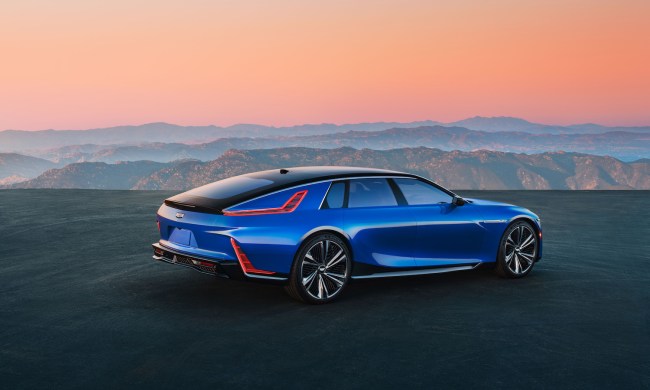 2023 Cadillac Celestiq rear end angle from the driver's side overlooking mountains during a sunset.