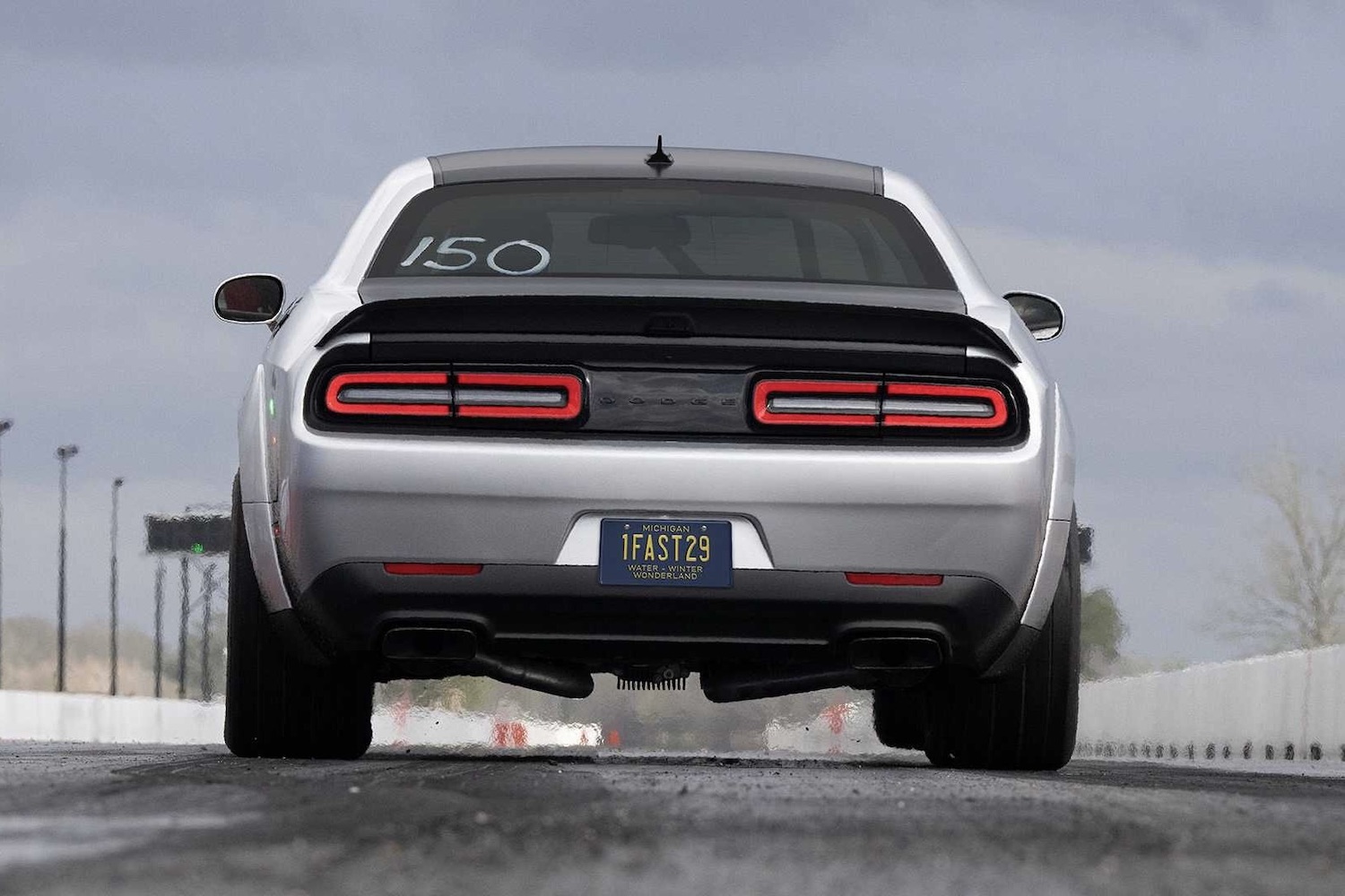 Close up of rear end of the 2023 Dodge Challenger SRT Demon 170 on a drag strip.