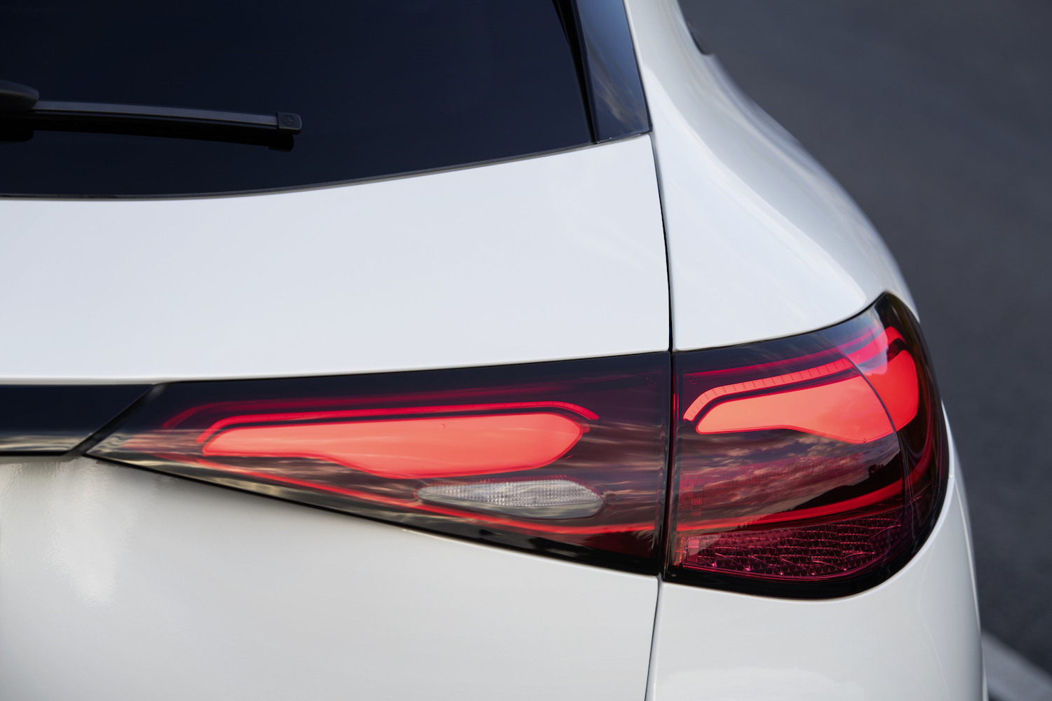 Close up of taillights on the 2023 Mercedes-Benz GLC parked on a street.