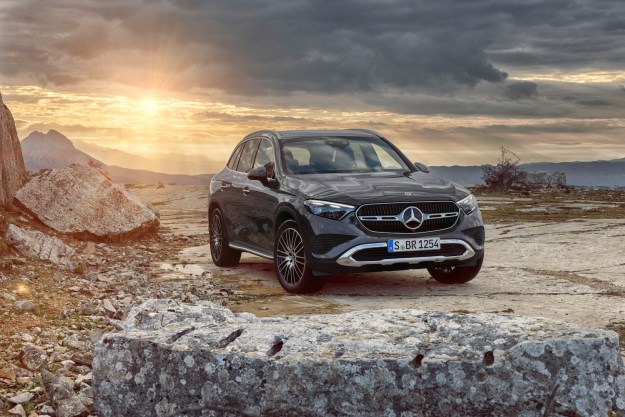 2023 Mercedes-Benz GLC front end angle from passenger's side parked in front of mountains during sunset.