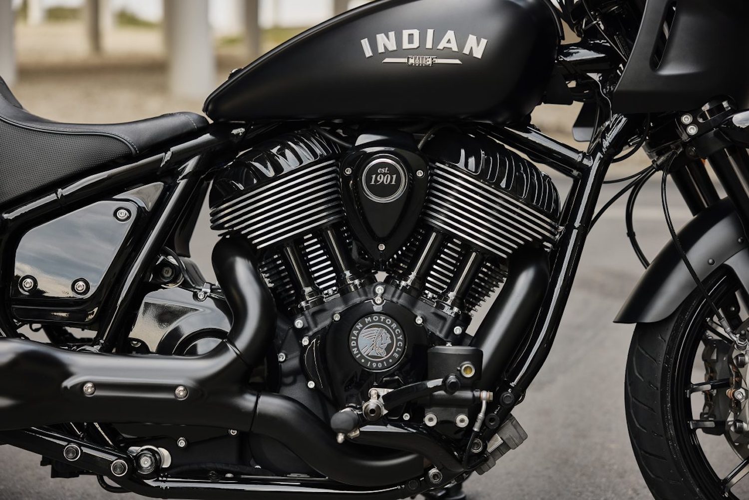 Close up of Thudnerstroke engine in the 2023 Indian Sport Chief with an underpass in the back.