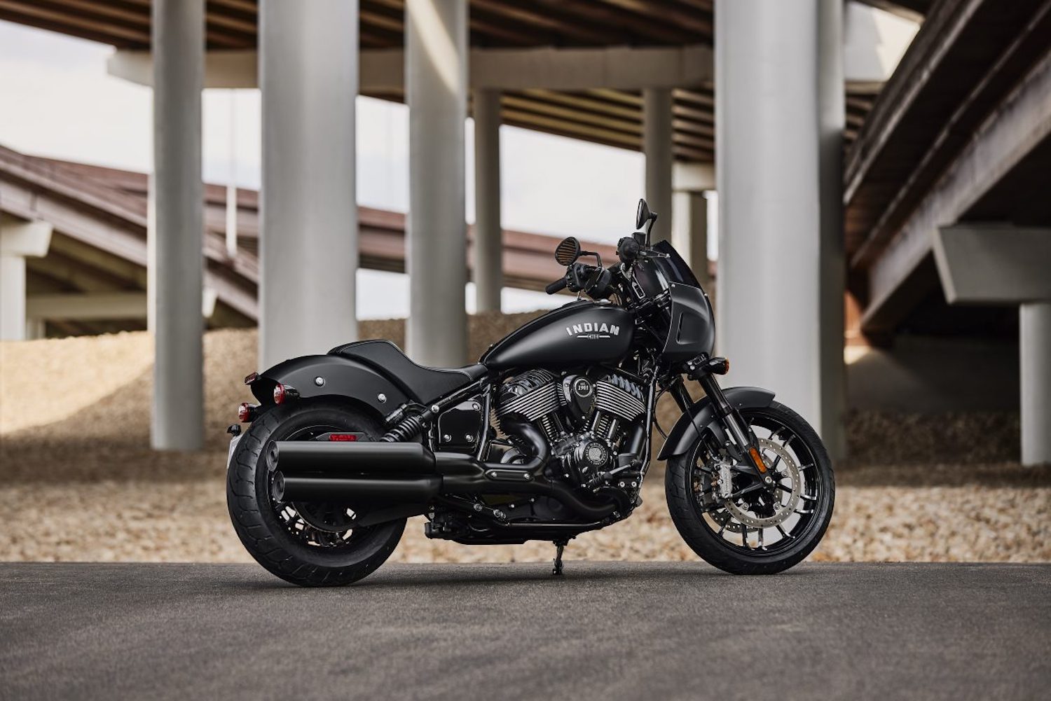 Side profile of the 2023 Indian Sport Chief parked under and underpass.