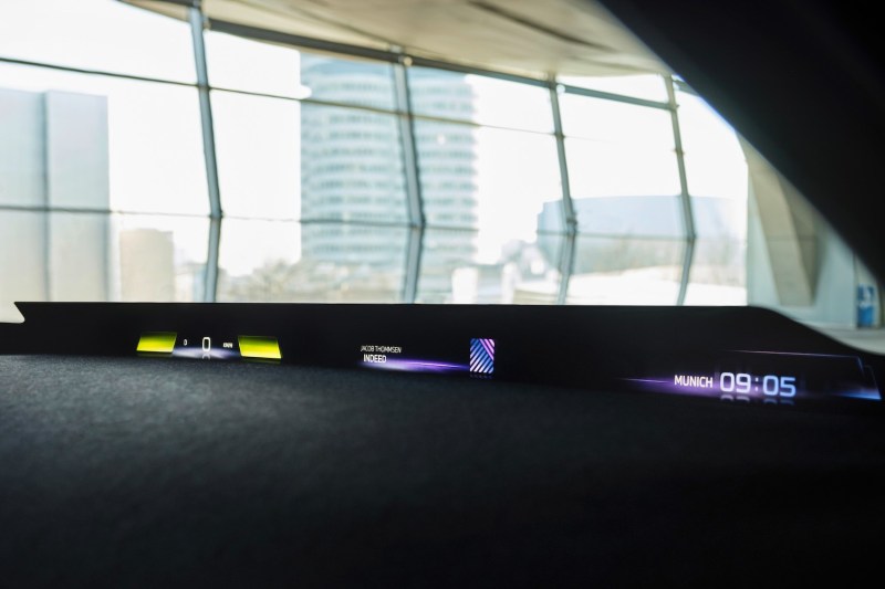 BMW Panoramic Vision in a concept vehicle parked in a building with windows and buildings in the back.