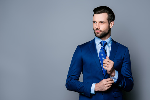 Man in suit and blue tie