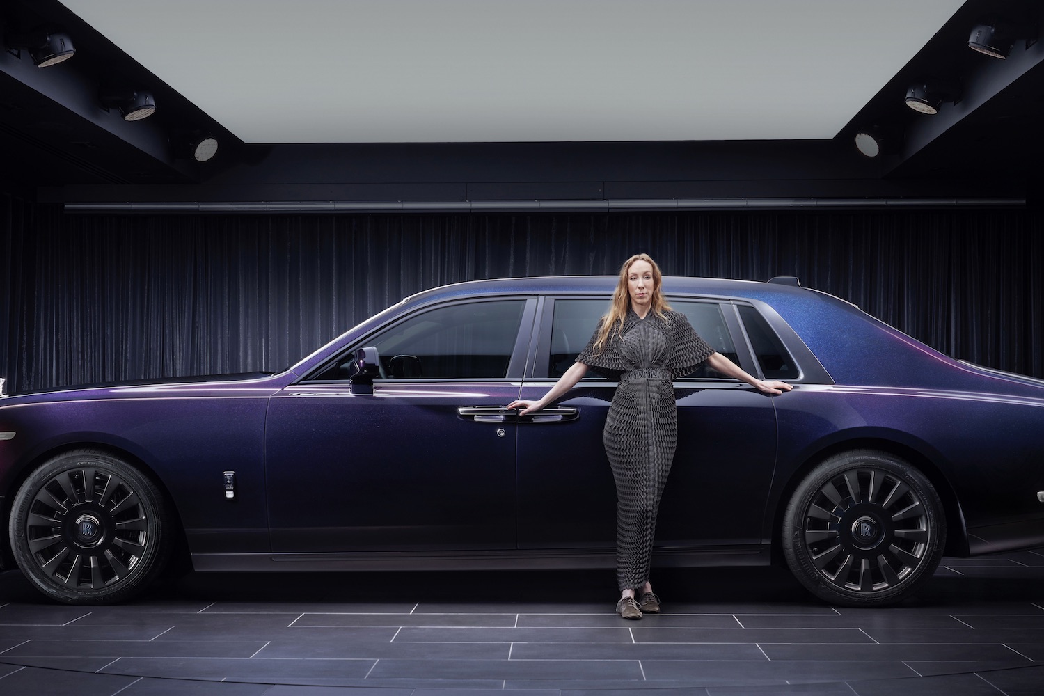 Side profile of the Rolls-Royce Phantom Syntopia parked in a studio with Iris van Herpen.