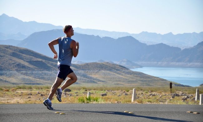 man running by mountain
