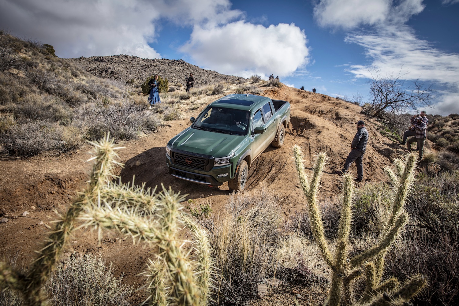 2022 Nissan Frontier Pro-4X coming down a steep hill with cacti in the foreground.
