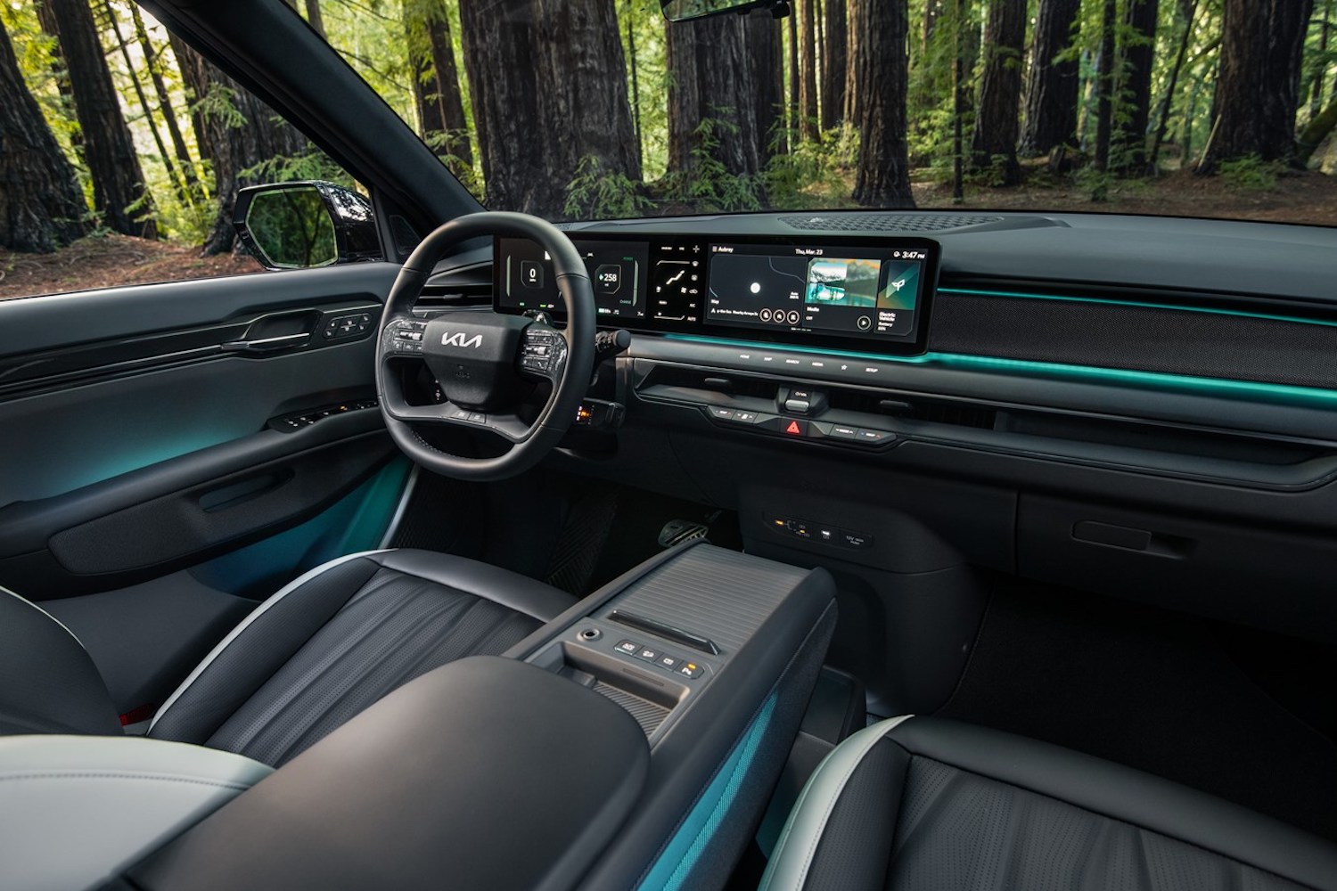 Steering wheel and dashboard in the 2024 Kia EV9 from passenger side.