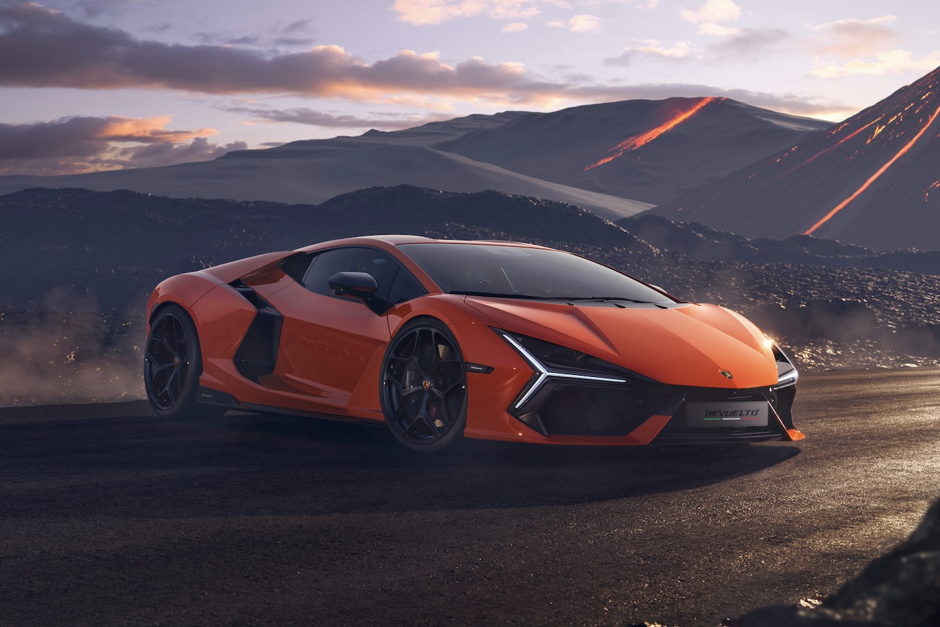 Front end angle of the 2024 Lamborghini Revuelto from the passenger side with a volcano in the back.