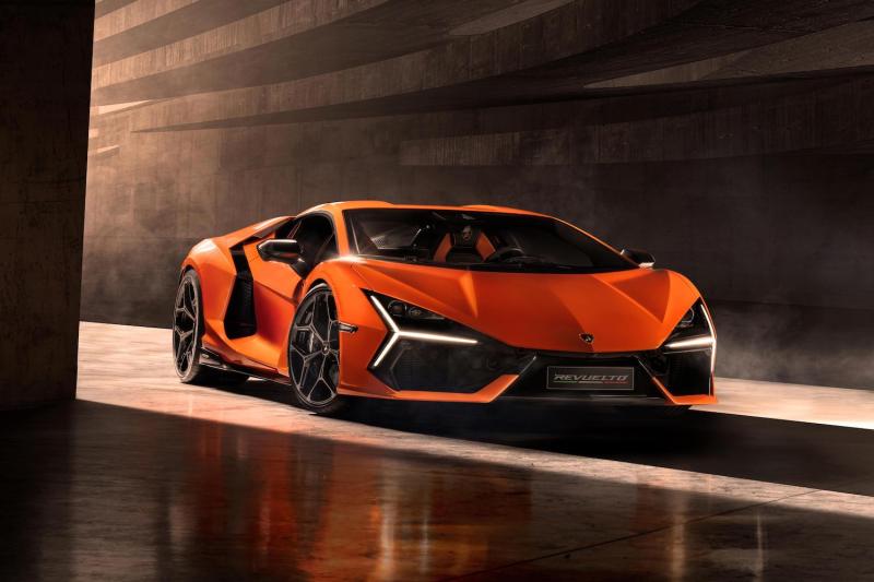 Front end angle of the 2024 Lamborghini Revuelto from passenger's side parked in a studio.