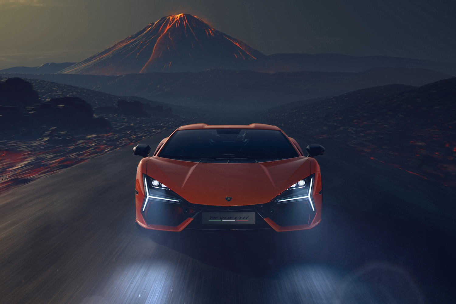 2024 Lamborghini Revuelto front end with headlights on with volcano in the back.