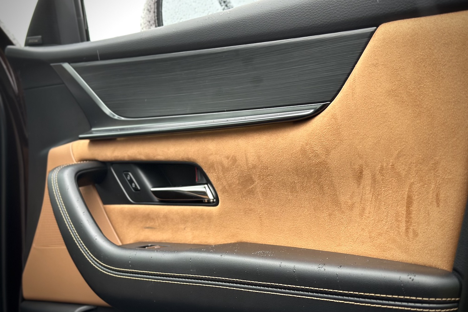 Close up of the door in the 2024 Mazda CX-90 from the passenger side.
