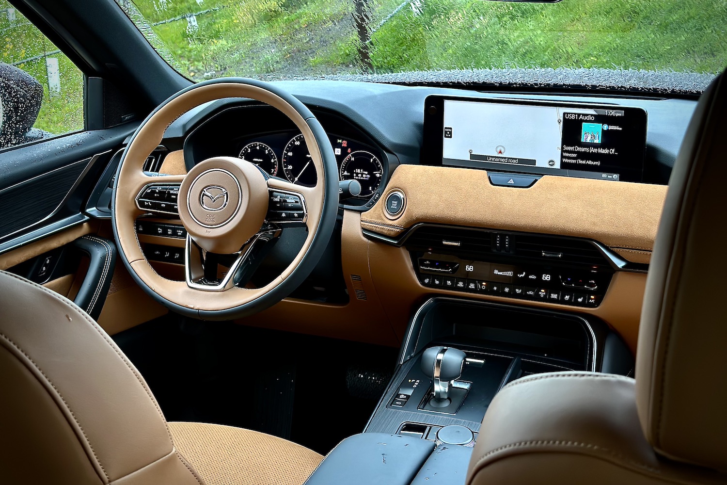 Close up of steering wheel and dashboard in the 2024 Mazda CX-90.