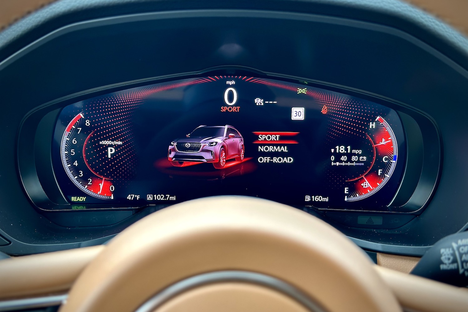 Close up of instrument cluster in the 2024 Mazda CX-90 with sport mode engaged.