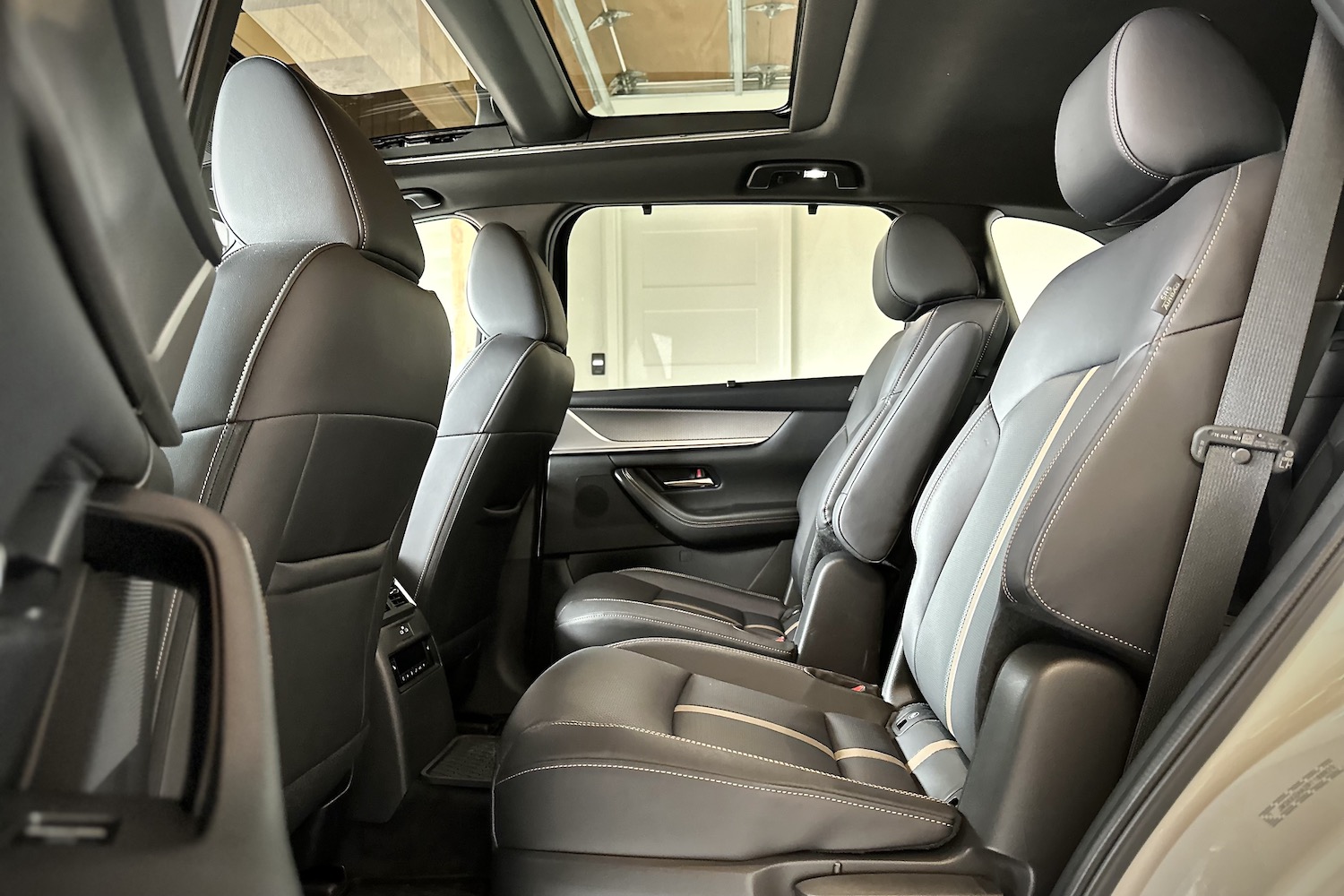 Second-row seats in the 2024 Mazda CX-90 PHEV from the driver's side.