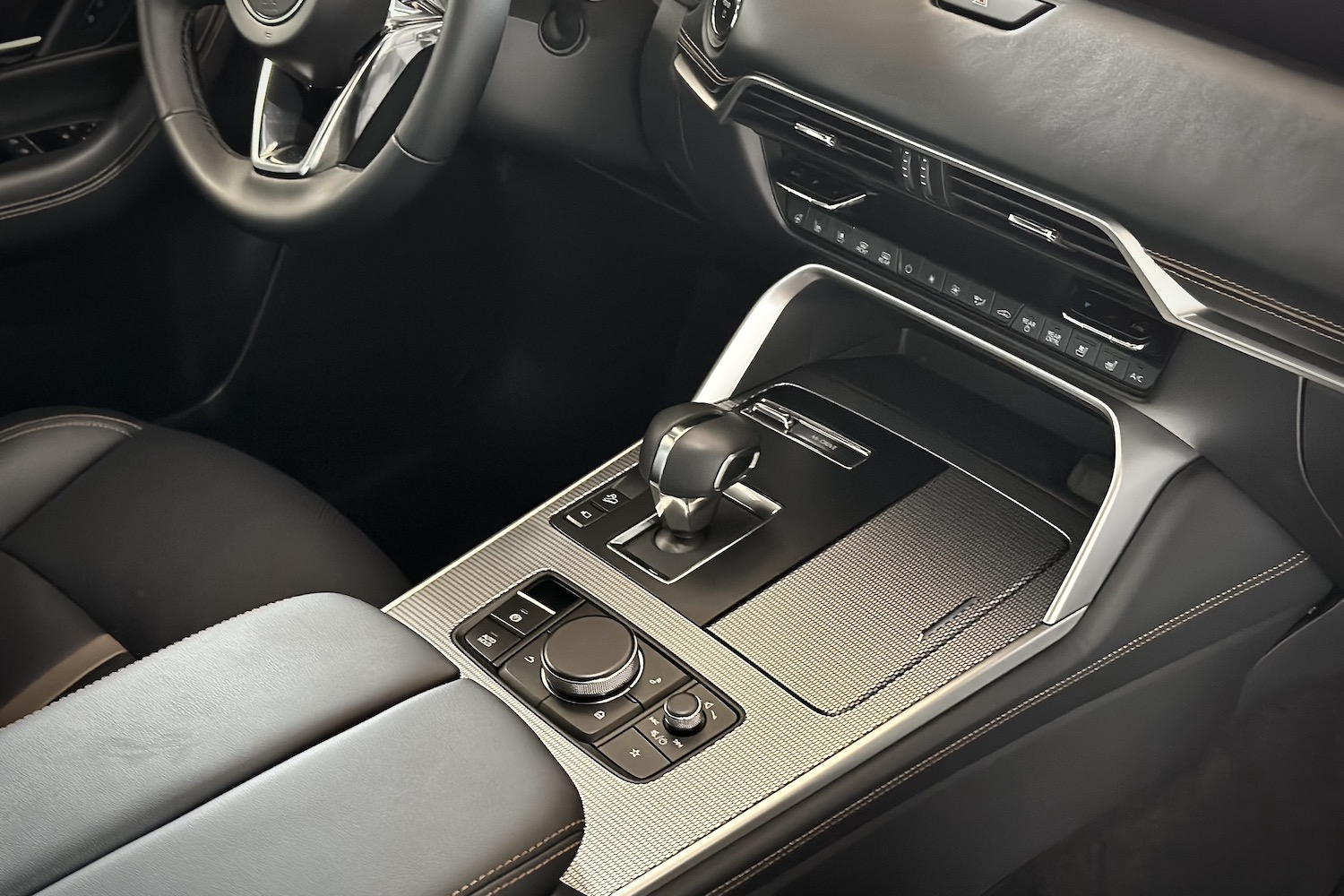 Close up of center console and gear shifter in the 2024 Mazda CX-90 PHEV.