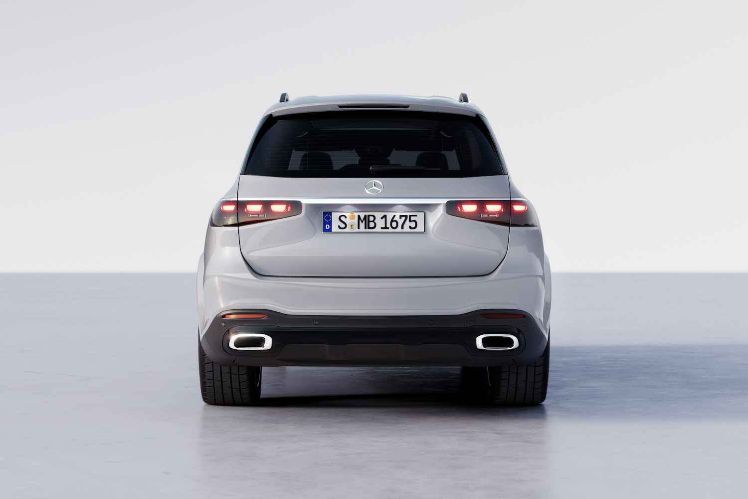 Close up of rear end 2024 Mercedes-Benz GLS parked in a white studio.