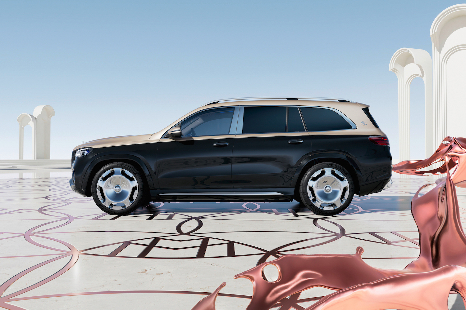 Side profile of the 2024 Mercedes-Benz GLS Maybach 600 parked in front of the Maybach logo.
