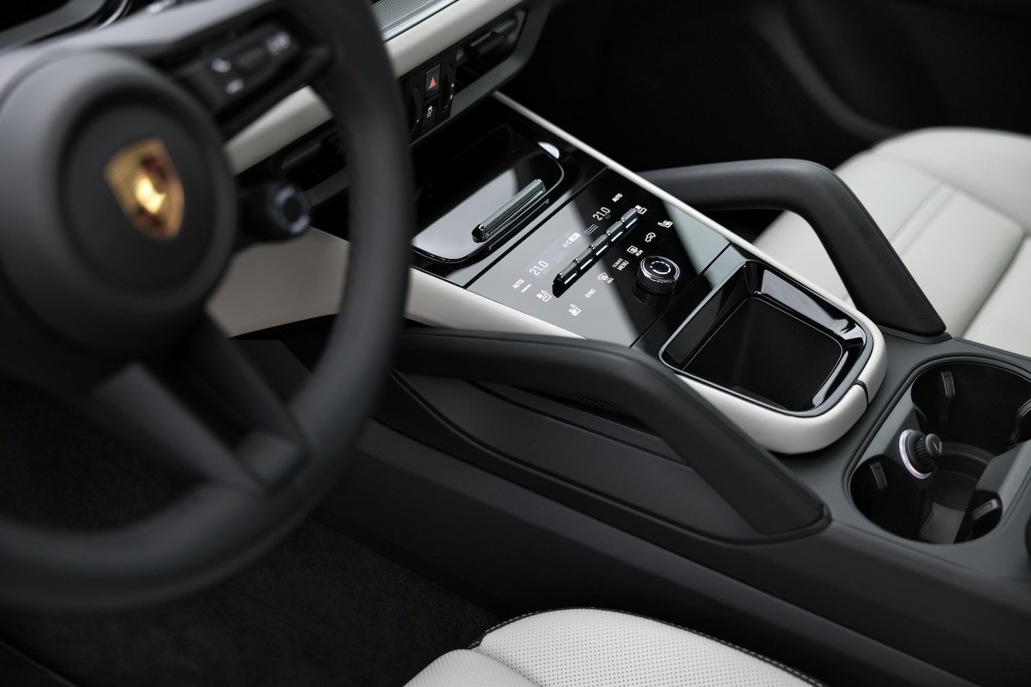 close up of transmission tunnel in the 2024 Porsche Cayenne from outside the SUV.