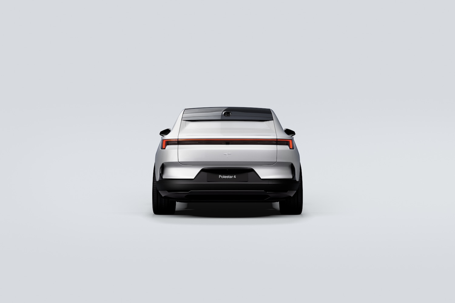 Close up of rear end of the 2025 Polestar 4 parked in front of a white background.