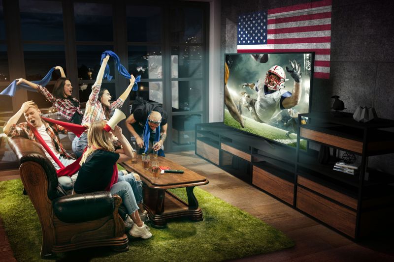 Friends watching football on TV