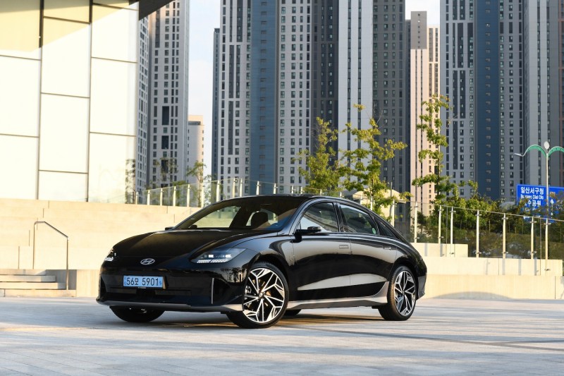 2023 Hyundai IONIQ 6 front end angle parked in front of city buildings.