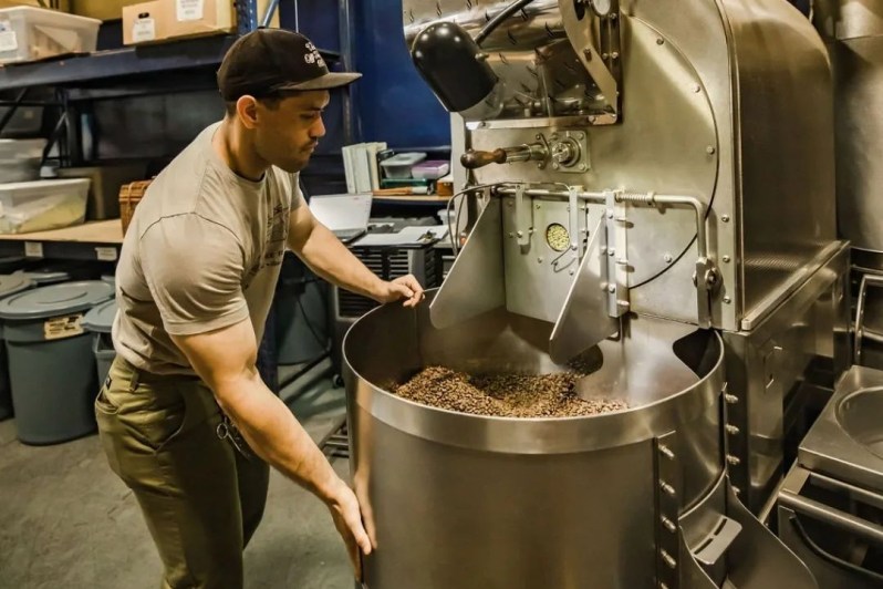 Roasting coffee at Maui Coffee Roasters.