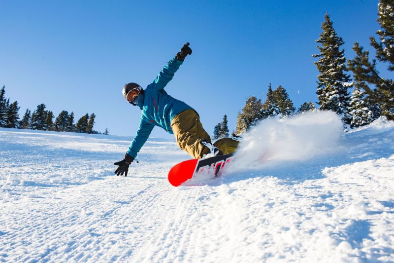 Snowboarder with orange board