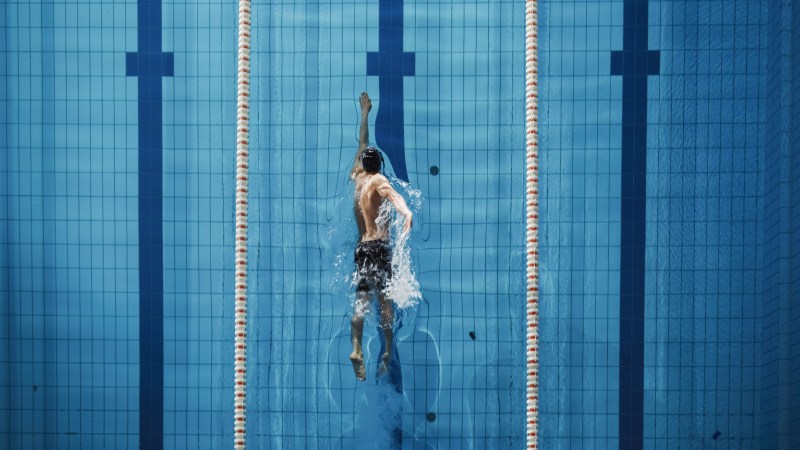 Man swimming freestyle.