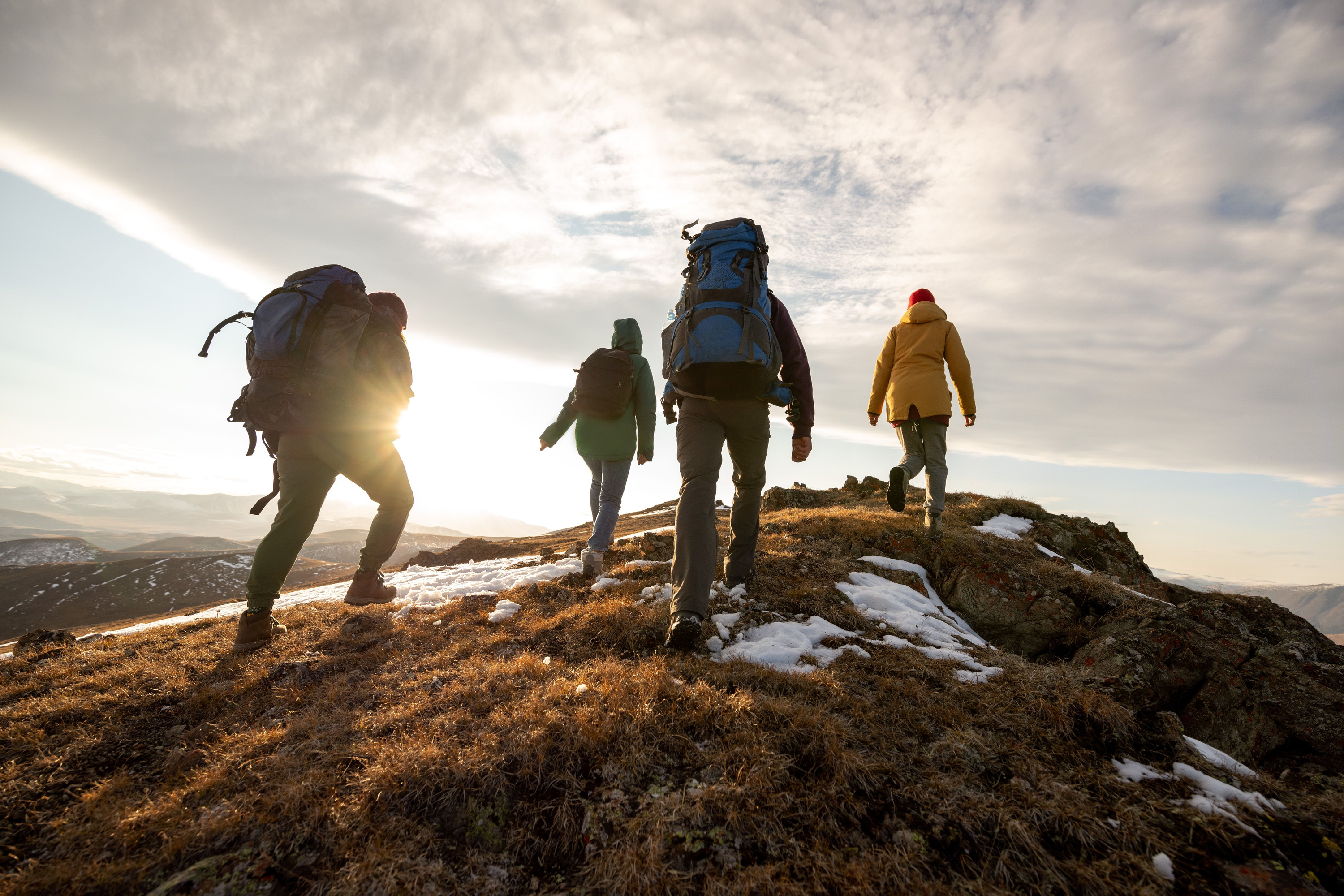 Group hiking at sunset