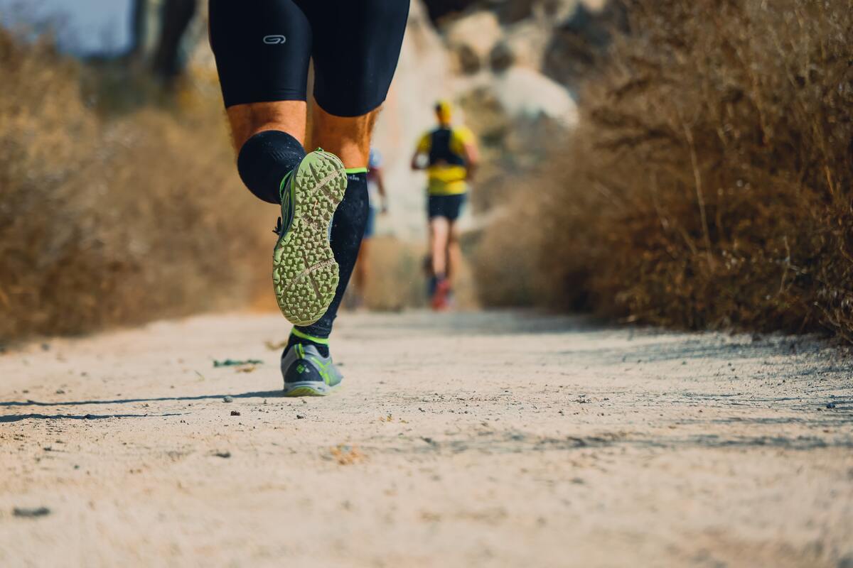 Man running on trail.