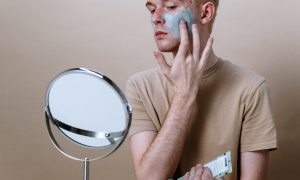 man with green acne cream
