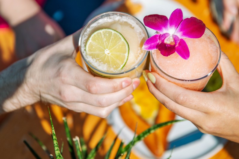 A toast with two Sure Sure cocktails