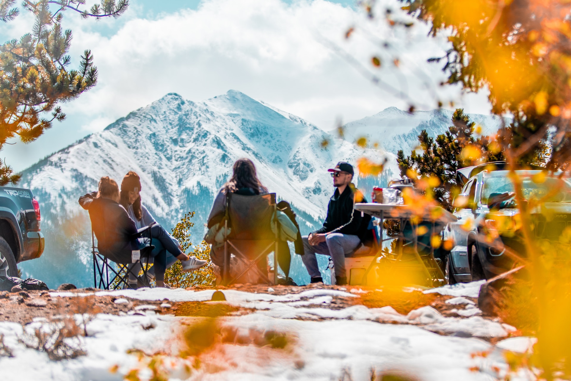 People sitting around a campground.