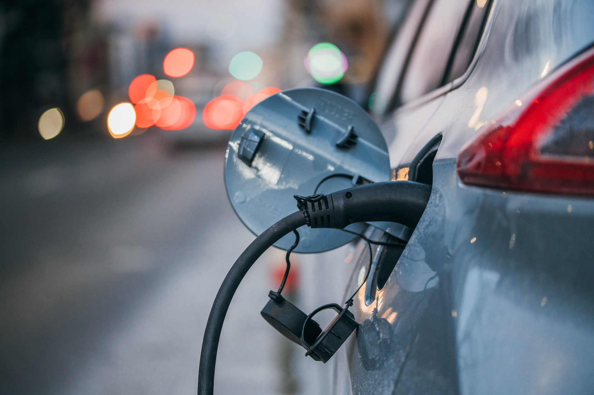 Electric car plugged into charger