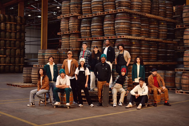 Jameson Irish Whiskey and Dickies Collaboration team standing in front of barrels