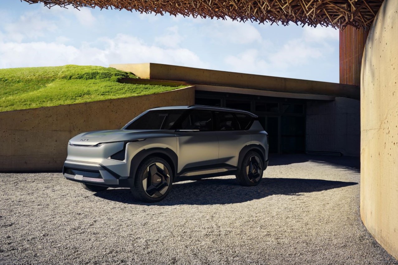 Kia EV5 concept car parked in front of a house